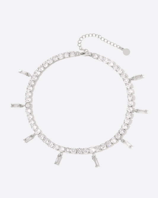 ICED BAGUETTE TENNIS ANKLET. - 4MM WHITE GOLD